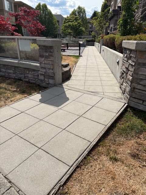 Sidewalk power washing at a residential complex