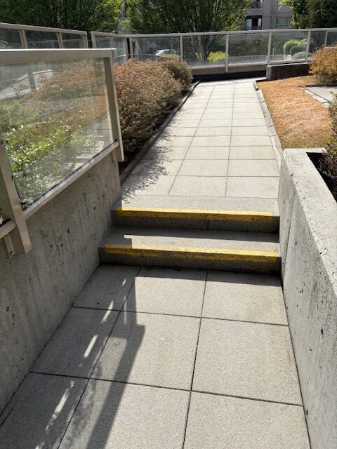 Power washing of residential complex pathway