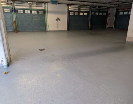 Restoration of parking deck surface with protective layers